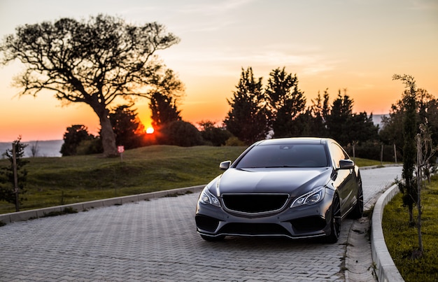 grey-luxury-sedan-car-sunset